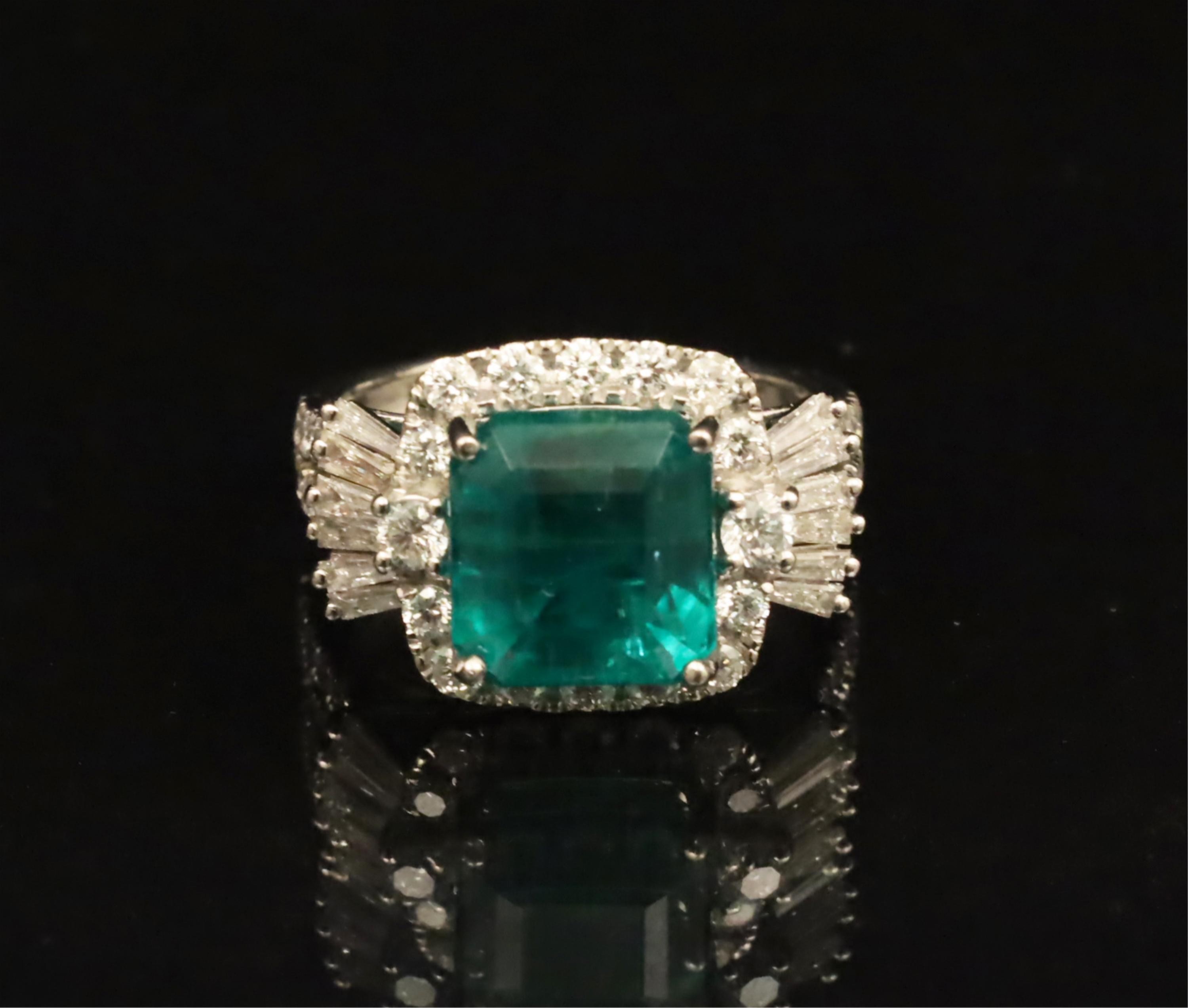 Appraisal: PLATINUM EMERALD AND DIAMOND LADY'S RING Platinum Emerald and Diamond