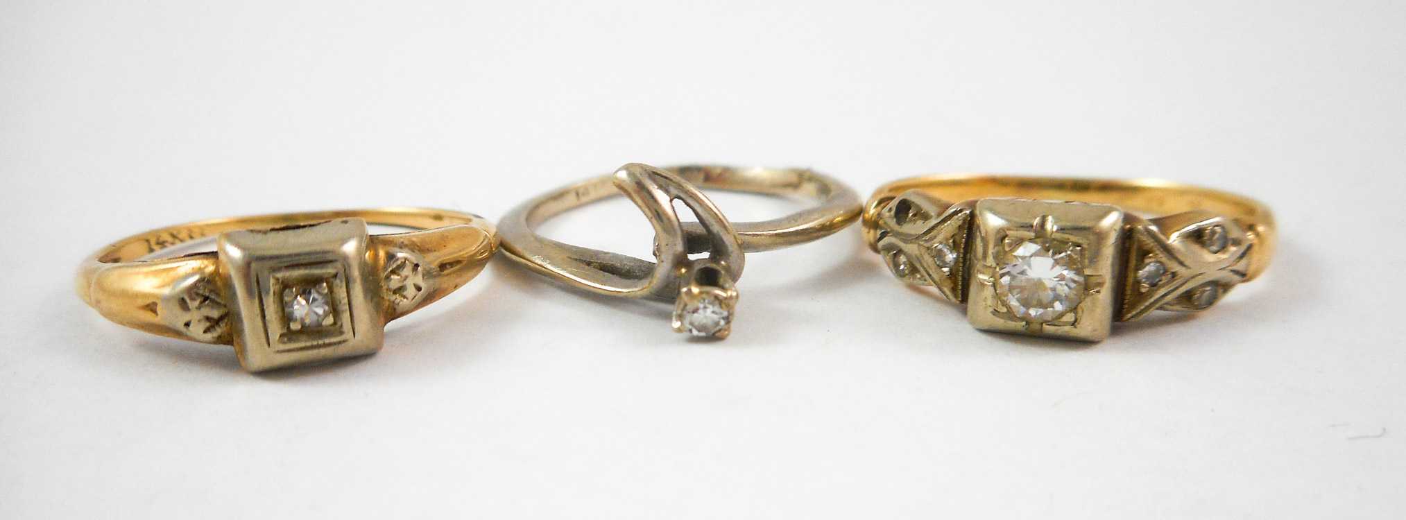 Appraisal: THREE DIAMOND AND FOURTEEN KARAT GOLD RINGS including a size