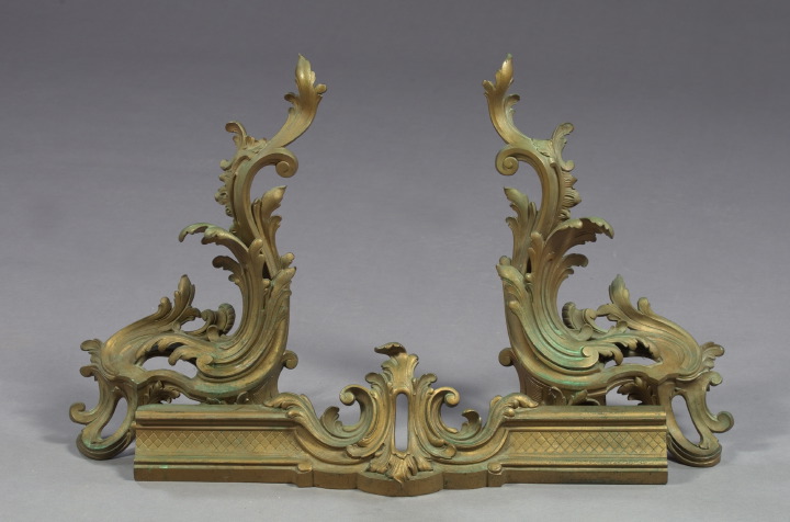 Appraisal: Large Pair of Gilded Brass Chenets of scrolling form in