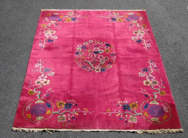 Appraisal: Chinese room size rug in magenta with floral designs MEASUREMENTS