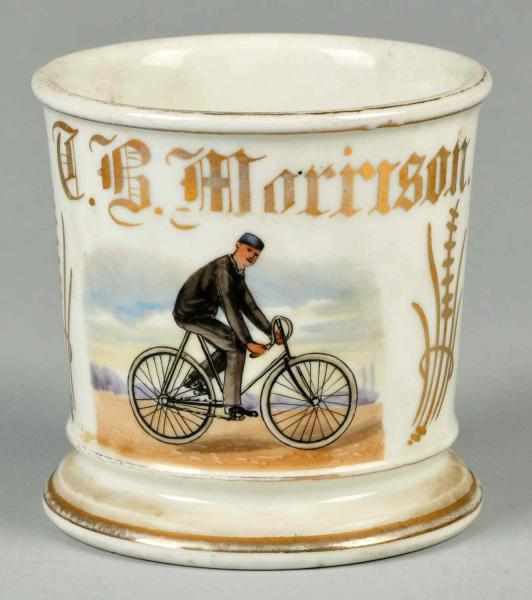 Appraisal: Man Riding Bicycle Shaving Mug Description Gilt name T B