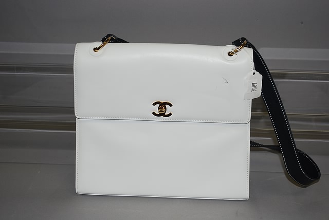 Appraisal: Chanel White calf handbag with blue strap gold accent Pen