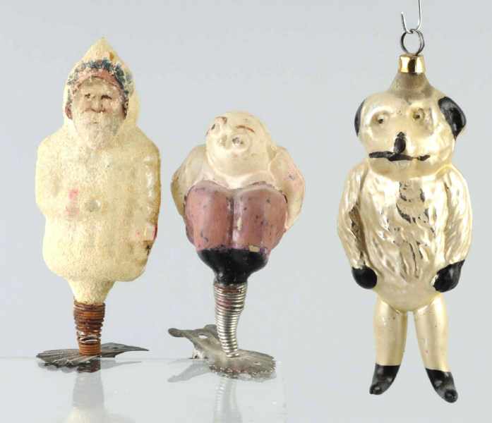 Appraisal: Lot of Rare Figural Christmas Ornaments Description Includes man squatting