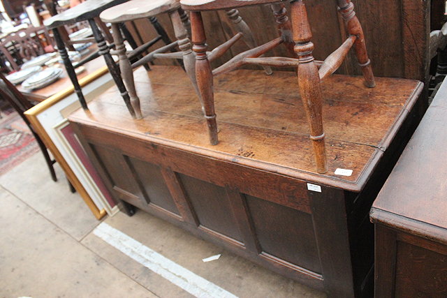 Appraisal: AN ANTIQUE OAK COFFER of pegged construction with quadruple panelled