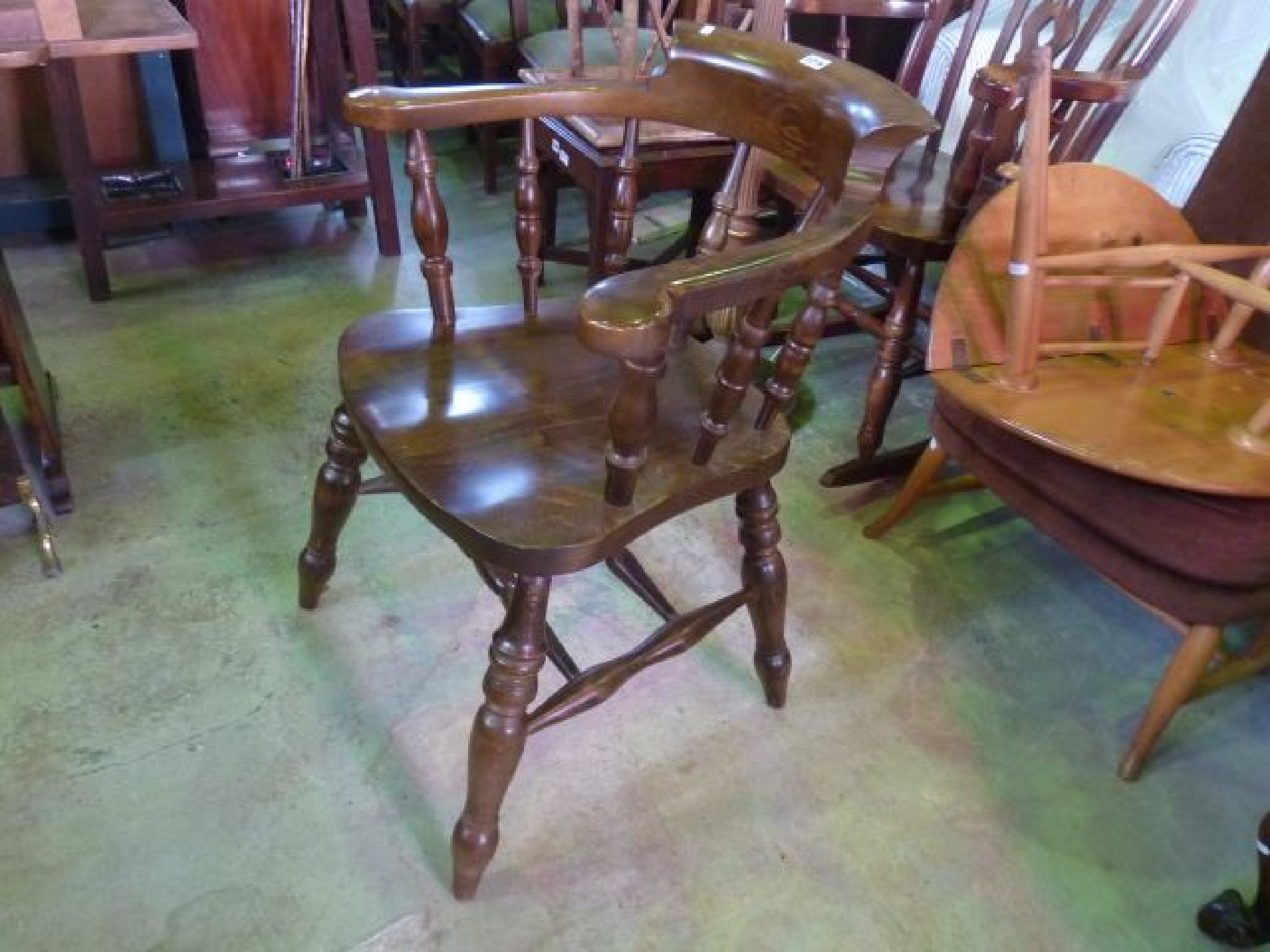 Appraisal: A Windsor captains chair of usual form with turned spindle