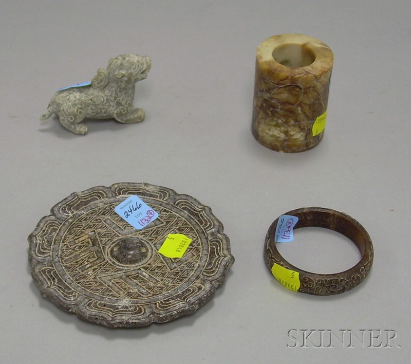 Appraisal: Four Carved Archaic-style Jades a mythical beast a bangle and