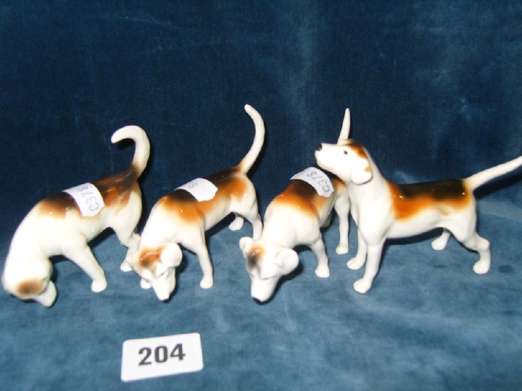 Appraisal: A set of four Beswick hounds in different positions