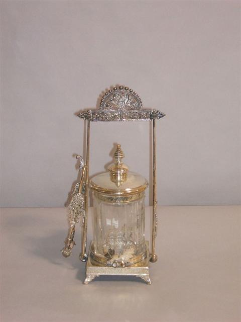 Appraisal: AMERICAN SILVERPLATE GLASS PICKLE CASTOR Circa in the Eastlake style