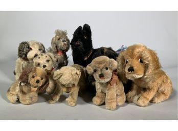 Appraisal: Nine vintage stuffed dogs with glass eyes of varying sizes