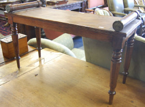 Appraisal: Victorian mahogany window seat the moulded rectangular seat with scrolled