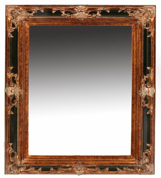 Appraisal: A Continental parcel gilt and ebonized mirror height in width