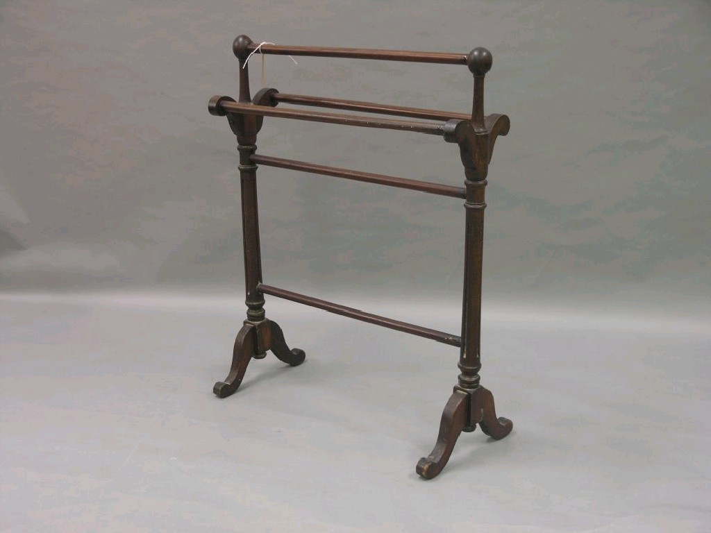 Appraisal: A Victorian mahogany towel rail on fluted end supports