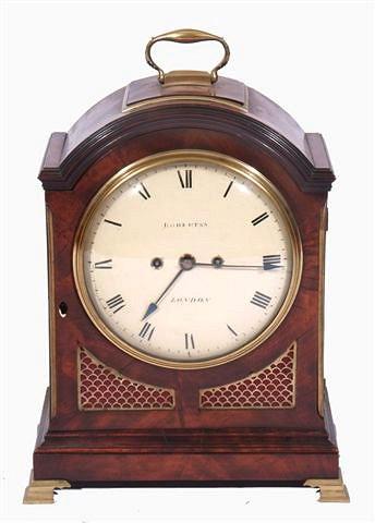 Appraisal: A REGENCY MAHOGANY BRACKET CLOCK the break arch case with