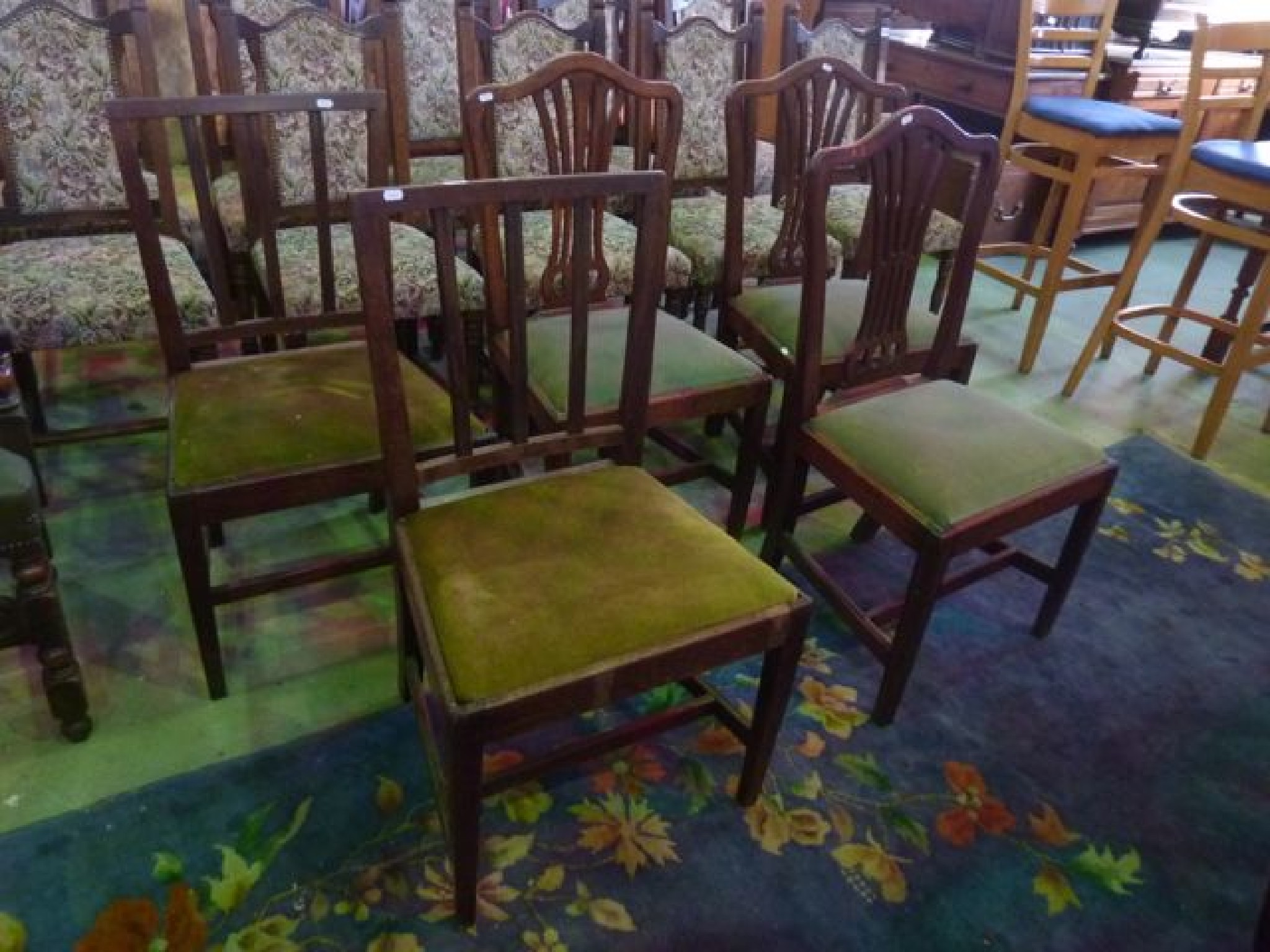 Appraisal: A set of three Georgian mahogany dining chairs in the