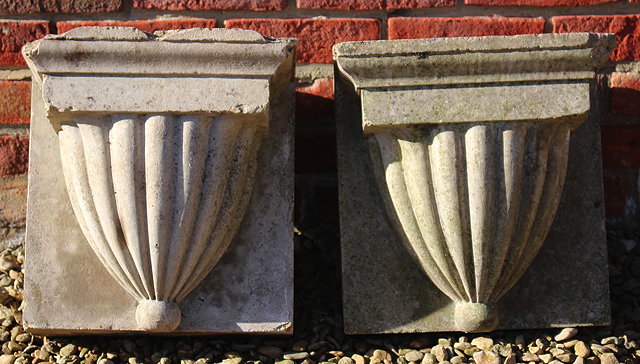 Appraisal: A PAIR OF TERRACOTTA CORBELS with waisted fluted decoration cm