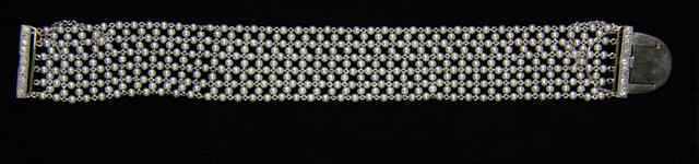 Appraisal: An eleven-row seed pearl bracelet in a platinum setting with