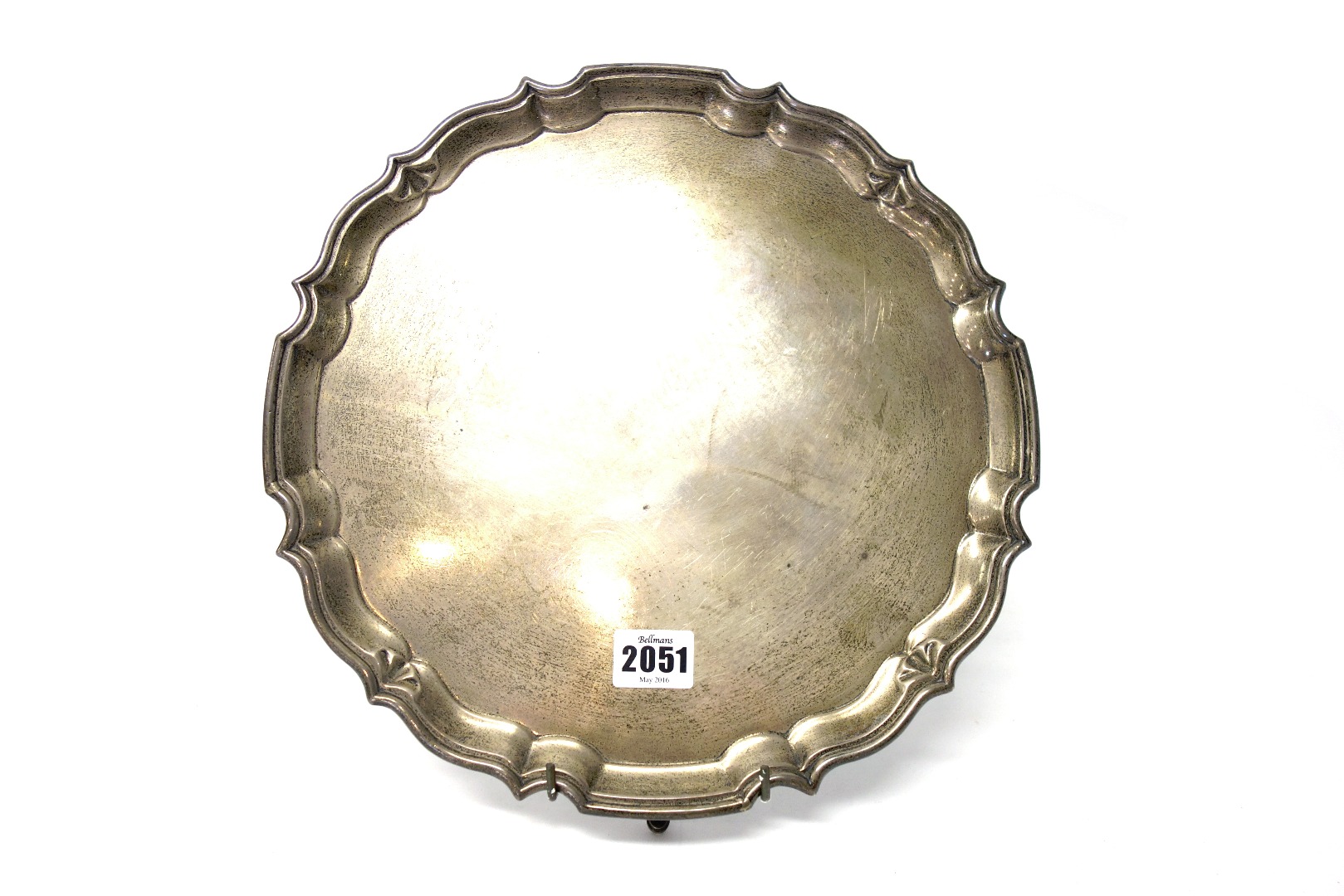 Appraisal: A silver shaped circular salver having a pie-crust rim in