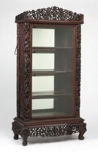 Appraisal: A Chinese carved hardwood vitrine cabinet Late th early th