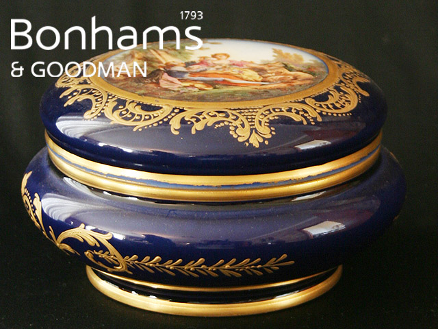 Appraisal: A French porcelain circular box and cover with painted roundel