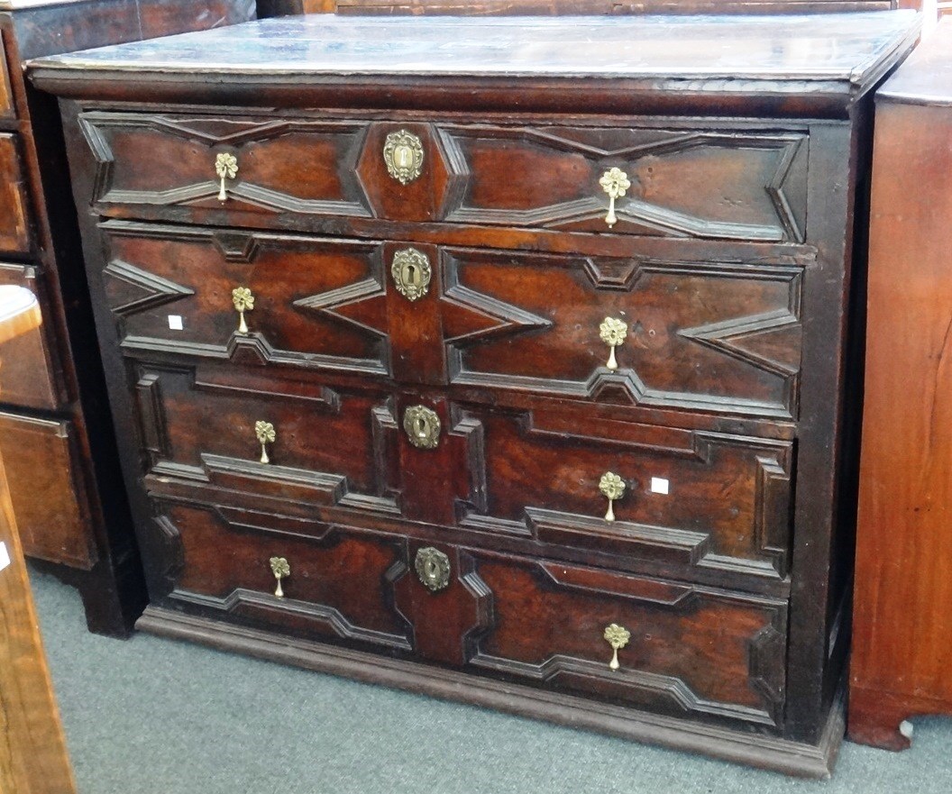 Appraisal: A th century oak chest of four long geometric moulded