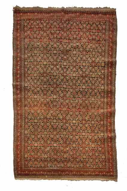 Appraisal: A SENNEH BLACK GROUND RUG with an intense foliate motif