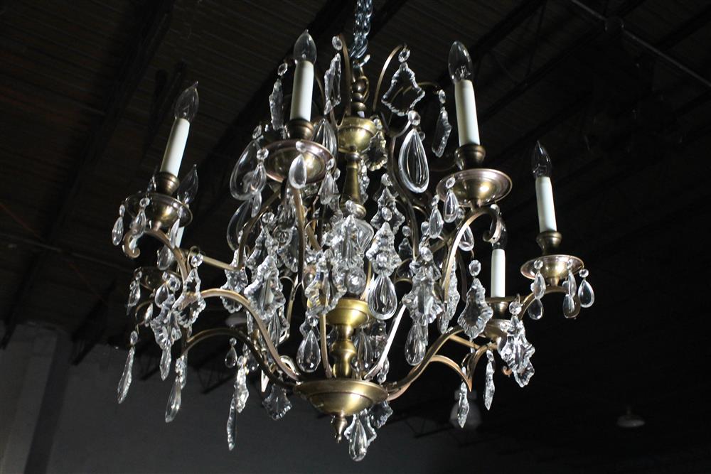 Appraisal: CRYSTAL AND BRASS EIGHT ARM ELECTRIFIED CHANDELIER electrified with hanging