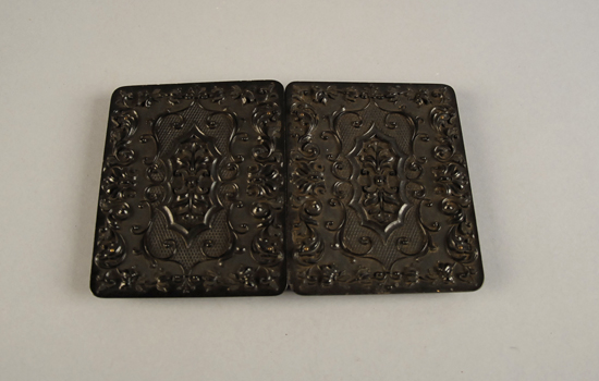 Appraisal: A th C Thermoplastic Photograph Case folding for two photos