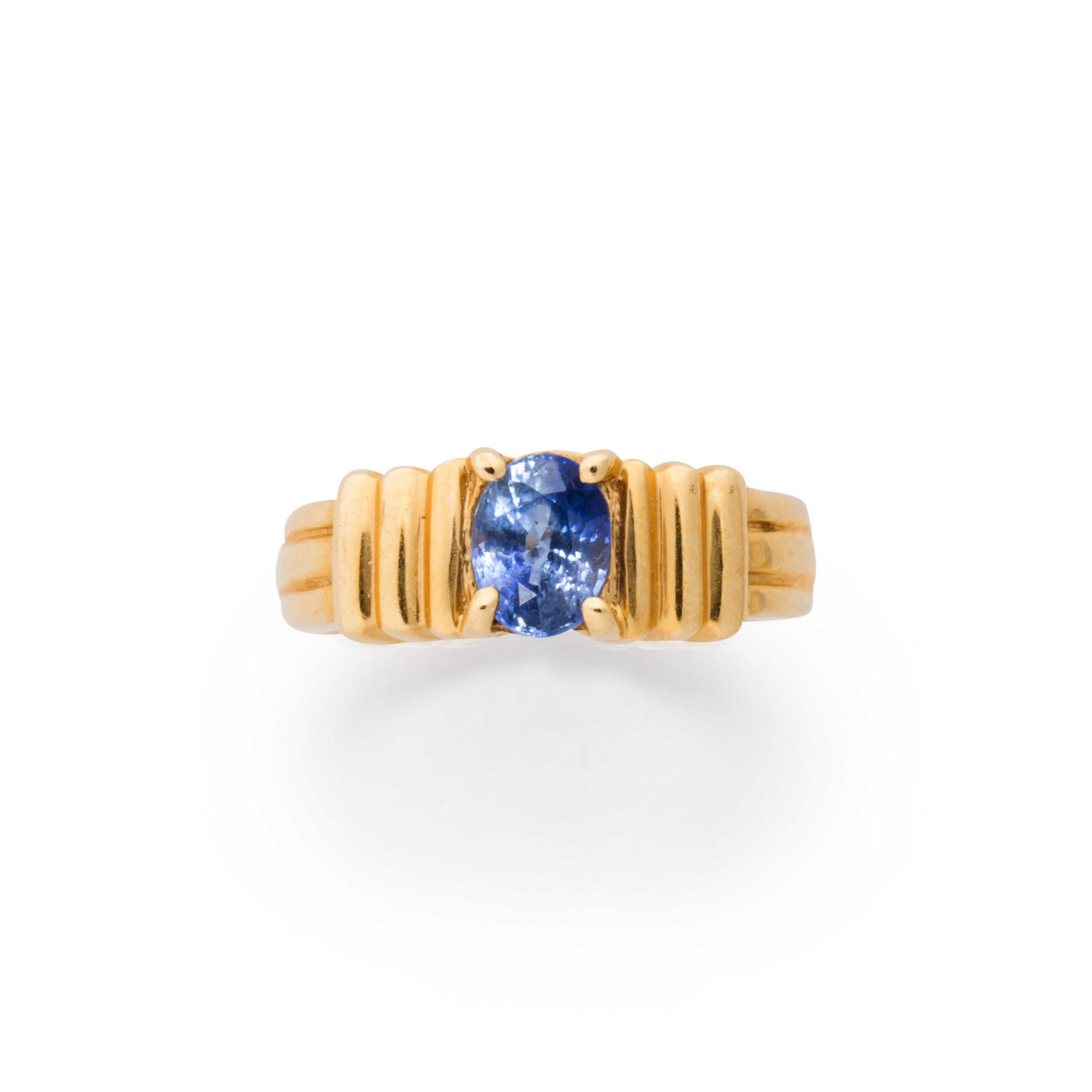 Appraisal: A SAPPHIRE AND FOURTEEN KARAT GOLD RING A sapphire and