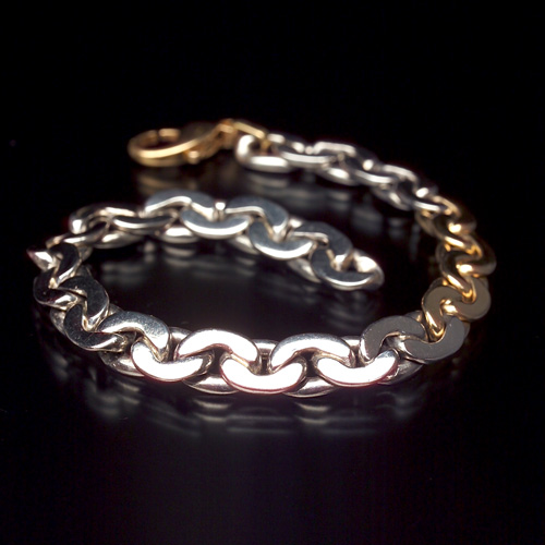 Appraisal: PLATINUM AND K GOLD Solid chain-link bracelet with k lobster-claw