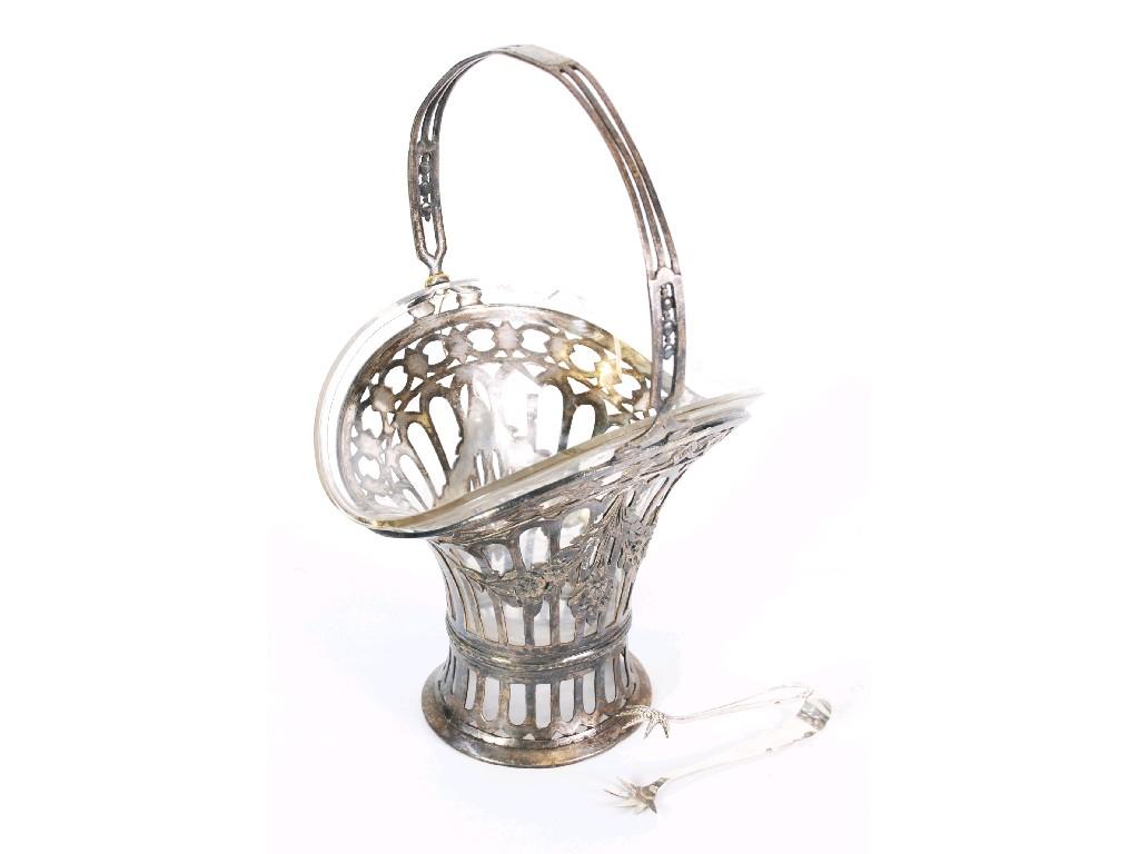 Appraisal: CONTINENTAL PIERCED WHITE METAL FLOWER BASKET with clear glass liner