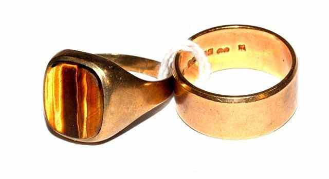 Appraisal: A CT GOLD WEDDING BAND and a gold signet ring