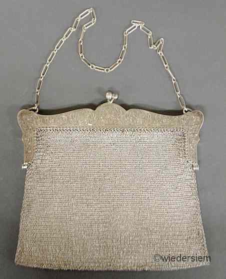 Appraisal: Sterling silver mesh purse with an ornately engraved sterling silver