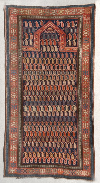 Appraisal: A CAUCASIAN BLUE GROUND PRAYER RUG decorated numerous rows of