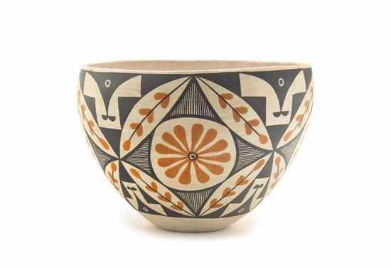 Appraisal: An Acoma Polychrome Jar with round cartouches floral and elongated