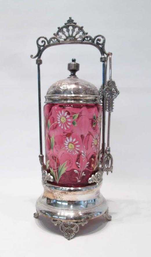 Appraisal: VICTORIAN PICKLE CASTOR cranberry glass enameled with floral motif fitted