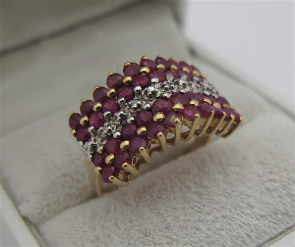 Appraisal: RUBY DIAMOND AND KARAT GOLD RING set with round-cut diamonds