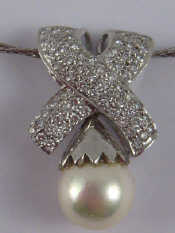 Appraisal: A white metal tests carat gold cultured pearl and diamond