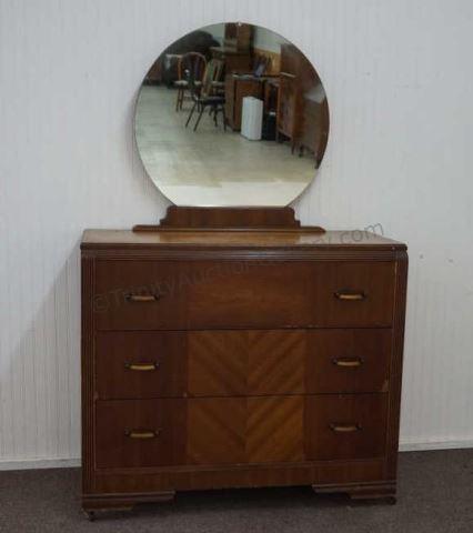 Appraisal: 's- 's Art deco era mahogany drawer dresser with round