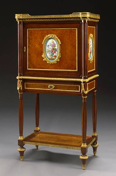 Appraisal: A Louis XVI style gilt bronze and porcelain mounted amboyna