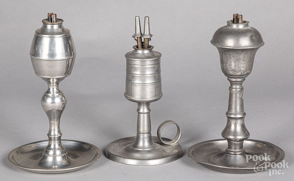 Appraisal: Three pewter whale oil lamps Three pewter whale oil lamps