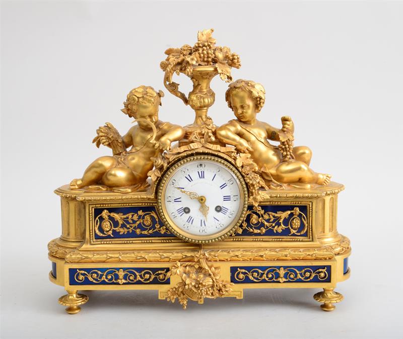 Appraisal: LOUIS XVI STYLE GILT-BRONZE AND METAL MANTLE CLOCK The face