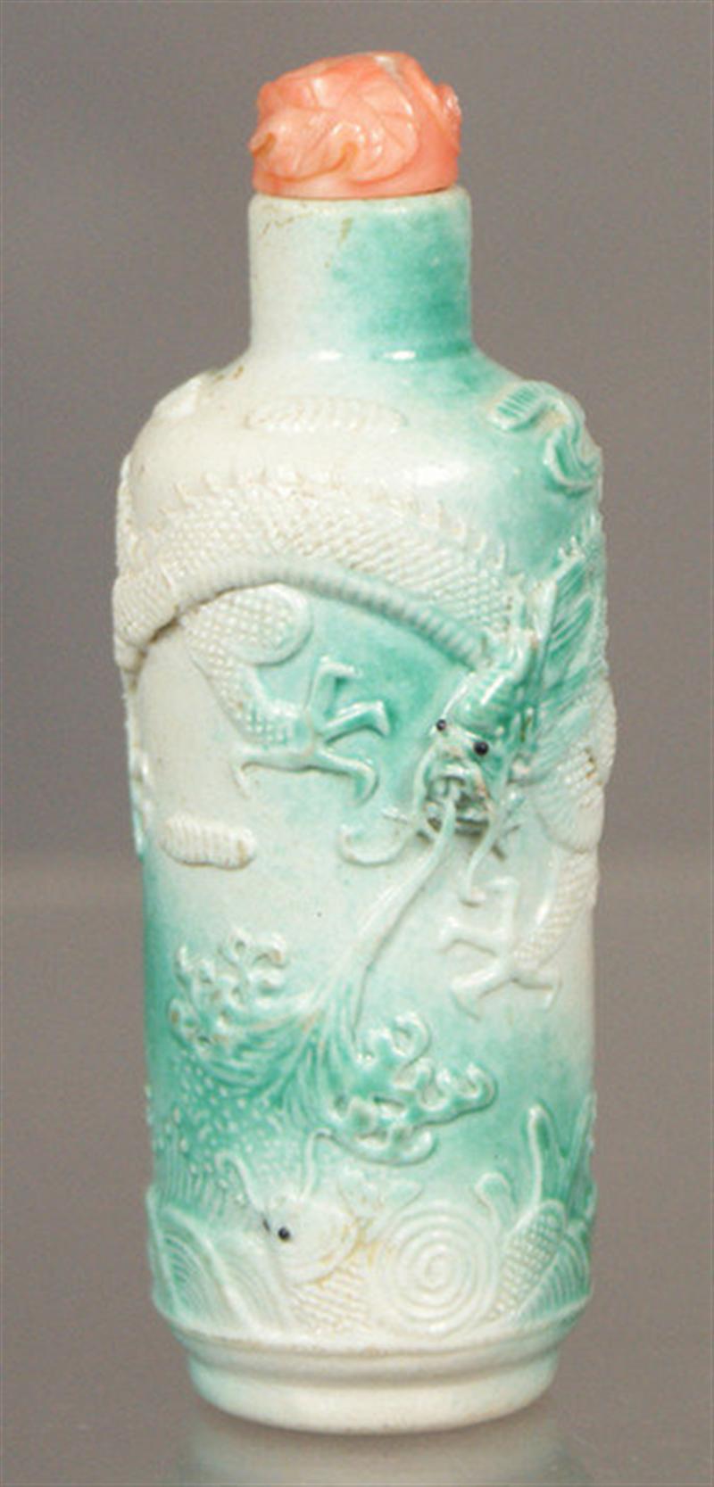 Appraisal: Porcelain snuff bottle with raised mottled green dragon seeking flaming