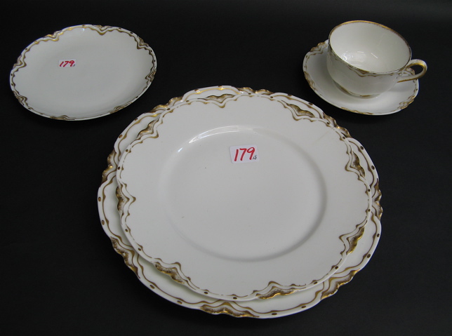 Appraisal: HAVILAND LIMOGES CHINA SET pieces with scalloped rim and gold