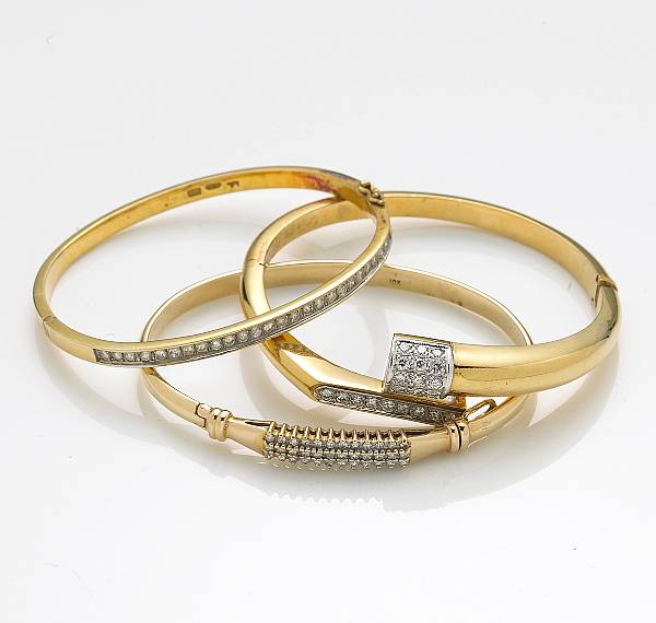 Appraisal: A group of three diamond k and k bicolor gold