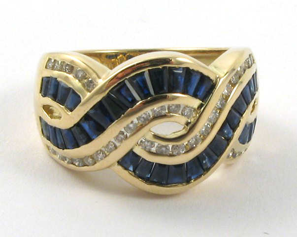 Appraisal: SAPPHIRE DIAMOND AND YELLOW GOLD RING The k gold band