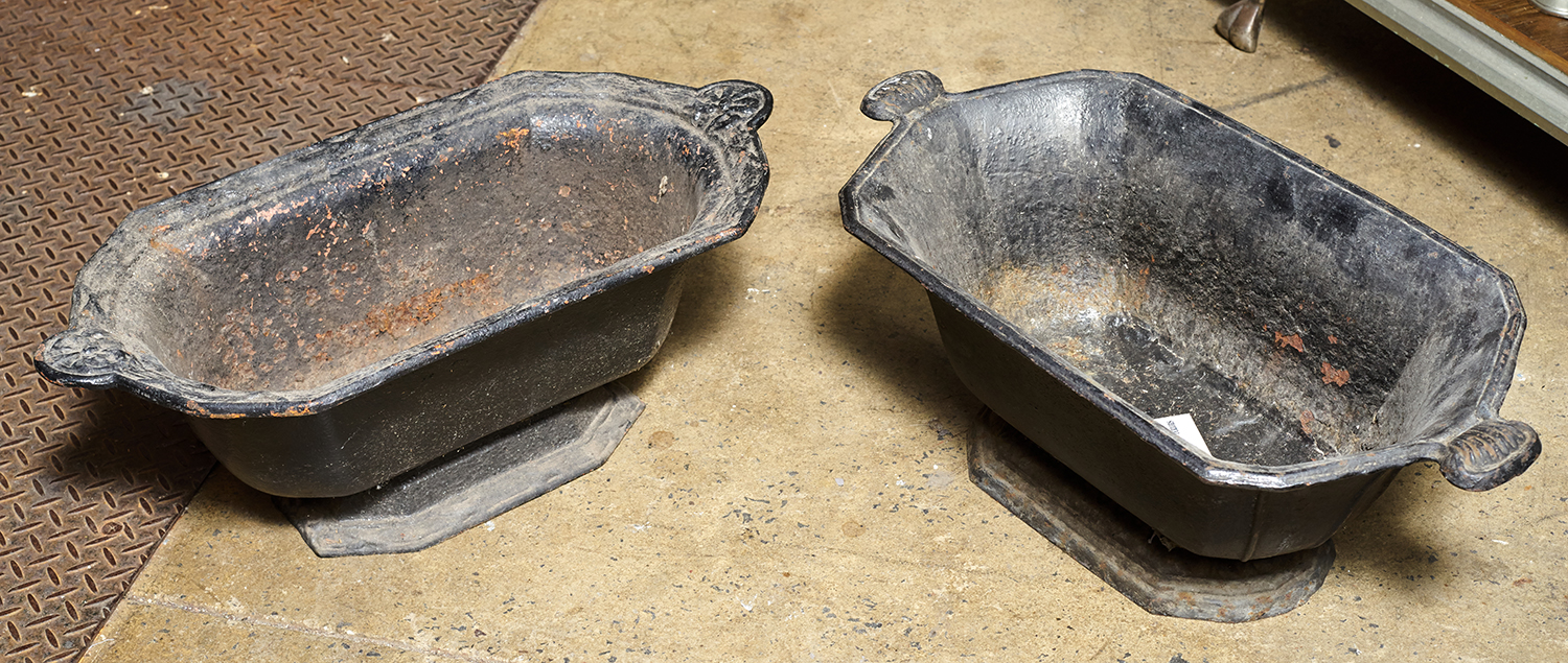 Appraisal: TWO ORNATE FRENCH CAST IRON PLANTERS Black finish to both