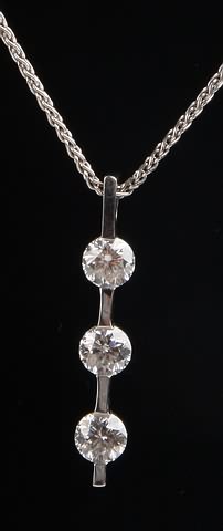 Appraisal: KW bar pendant on long wheat chain mm round diamonds