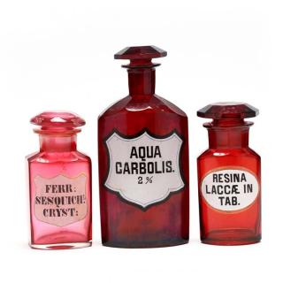 Appraisal: Three Ruby Red Glass Apothecary Bottles th century blown glass