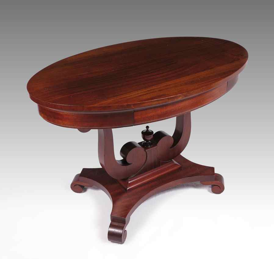 Appraisal: EMPIRE PERIOD OVAL MAHOGANY LAMP TABLE Oval top over a