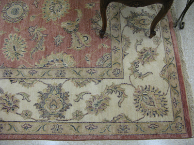 Appraisal: HAND KNOTTED ORIENTAL CARPET overall floral arabesque design on antique